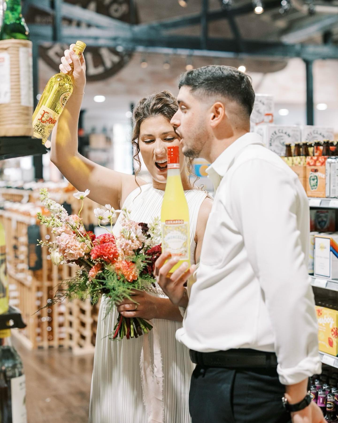 Newlyweds celebrating at the venue bar